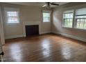 Empty living room featuring hardwood floors and lots of light at 921 Alabama Ave, Durham, NC 27705