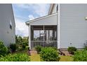 Relaxing screened porch with neutral siding, perfect for enjoying the outdoors at 1018 Excite Ave, Morrisville, NC 27560
