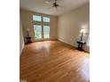 Cozy bedroom featuring hardwood floors, neutral walls, and a ceiling fan for added comfort at 1040 Bellenden Dr, Durham, NC 27713