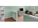 Inviting living space with wood floors, and view into the kitchen at 106 Lattimore Ln, Durham, NC 27713