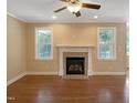Bright living room boasts a fireplace and abundant natural light at 1201 Dagmar Ln, Wake Forest, NC 27587