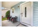 Inviting front porch with seating, showcasing the home's entrance and curb appeal at 128 Palmdale Ct, Holly Springs, NC 27540