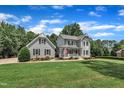 Lovely home featuring a welcoming front porch, well-manicured lawn, and mature trees, offering a serene and picturesque view at 171 St. Jiles Dr, Clayton, NC 27520