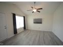Bright living room with vaulted ceilings, modern light fixture, and durable wood-look floors at 1848 Glenn St, Burlington, NC 27217
