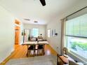 Open-concept living and dining space with hardwood floors and ample natural light at 1916 Hart St, Durham, NC 27703