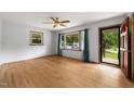 Spacious living room with hardwood floors, ceiling fan, and natural light at 218 Forestville Rd, Wake Forest, NC 27587