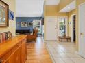Bright foyer featuring tile and wood floors, with a view into the living room and ample natural light at 224 Kirkwood Dr, Chapel Hill, NC 27514