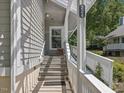 Covered front porch with stairs and white railings, providing a welcoming entrance to the home at 224 Kirkwood Dr, Chapel Hill, NC 27514