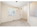 Inviting entryway with lots of natural light and a view of the staircase at 2241 Spruce Shadows Ln, Raleigh, NC 27614