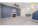 Open concept living room with cozy fireplace and lots of natural light at 2241 Spruce Shadows Ln, Raleigh, NC 27614