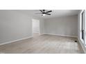 Bright, spacious living room with neutral walls, ceiling fan, and large window at 2905 Scuppernong Ln, Durham, NC 27703