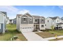 Beautiful two-story home with a two-car garage and welcoming front lawn landscaping at 3421 Lebrun Path, Fuquay Varina, NC 27526