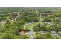 Community aerial showcasing the home's proximity to lush greenery and winding residential streets at 427 Elm Ct, Burlington, NC 27217
