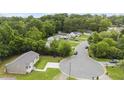 Aerial view of the neighborhood, displaying well-maintained lawns and tree-lined streets at 427 Elm Ct, Burlington, NC 27217