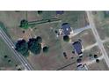 Aerial view shows large lot and location. The property features an outdoor kitchen and garden at 56 Sugarhill Dr, Zebulon, NC 27597