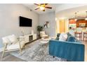 Open-concept living room with modern furniture and a view of the kitchen at 618 N Boylan Ave # 520, Raleigh, NC 27603