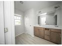 Bright bathroom featuring a double vanity and tile flooring at 1108 Matterhorn Dr, Fuquay Varina, NC 27526