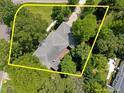 Aerial view of the property showing the home surrounded by mature trees at 116 Lost Tree Ln, Cary, NC 27513