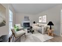 Bright living room with fireplace, neutral decor, and stylish furniture at 1302 Valley Run Dr, Durham, NC 27707