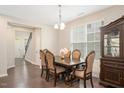 Bright dining room showcases a traditional table set and light fixture at 1416 Southpoint Trl, Durham, NC 27713