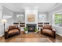 Cozy living room with built-in shelving and a fireplace, creating a warm and inviting atmosphere at 1920 Hart St, Durham, NC 27703