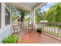 Inviting front porch with comfortable seating, offering a relaxing outdoor space and neighborhood view at 1920 Hart St, Durham, NC 27703