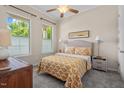 Bright bedroom featuring a neutral palette, plush carpet, and large windows at 3312 Flat River Dr, Durham, NC 27703
