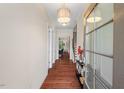 Inviting foyer with hardwood floors, a glass-paneled front door, and staircase access at 3312 Flat River Dr, Durham, NC 27703