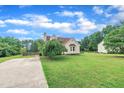 This home features an expansive yard with potential for outdoor enjoyment and landscaping, complemented by a classic exterior design at 35 Stratton Ct, Youngsville, NC 27596