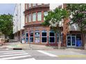 Corner street view of 300 West Rosemary with sidewalks, crosswalks, and colorful decor at 400 W Rosemary St # 114, Chapel Hill, NC 27516