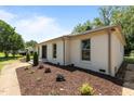 Landscaped home exterior with manicured shrubbery, and front yard at 620 Red Carriage Ave, Durham, NC 27704