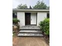 Charming front entrance featuring a slate tile porch, and a white front door at 620 Red Carriage Ave, Durham, NC 27704