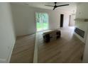 Bright living room featuring new flooring, fireplace and access to the outdoors at 620 Red Carriage Ave, Durham, NC 27704