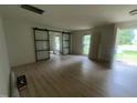 Spacious living room area, with glass sliding doors and neutral walls at 620 Red Carriage Ave, Durham, NC 27704
