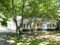 Inviting two-story home with a manicured lawn and attached garage at 637 Shadywood Ln, Raleigh, NC 27603