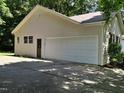 Spacious garage with ample parking space and a convenient side entrance at 637 Shadywood Ln, Raleigh, NC 27603