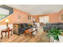 Spacious living room with comfortable seating and a view into the dining area at 713 Saint Catherines Dr, Wake Forest, NC 27587