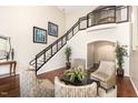 Grand entryway with a staircase, hardwood floors, and a seating area at 7250 Nc 751 Highway, #1205, Durham, NC 27707
