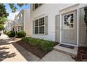 Attractive front entrance with a 'Welcome' mat and tidy landscaping in a cozy neighborhood at 8151 Rhiannon Rd, Raleigh, NC 27613