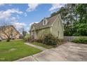 Charming home showcasing lush landscaping, a well-manicured lawn, and a private driveway at 816 Kimpton Ct, Fuquay Varina, NC 27526