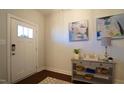 Welcoming entryway featuring neutral walls, stylish decor, and durable flooring at 966 Airedale Trl, Garner, NC 27529