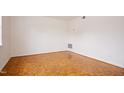 Bright bedroom with parquet floors and a large window offering natural light at 1002 Willow Drive # 63, Chapel Hill, NC 27514