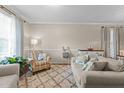 Relaxing living room showcasing a patterned rug, comfortable seating, and elegant decor at 136 Garden Retreat Dr, Garner, NC 27529