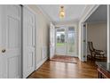 Inviting foyer with hardwood floors, closet, and natural light streaming through the front door at 1732 Edgewood Ave, Burlington, NC 27215