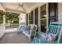 Cozy front porch featuring comfortable seating and ceiling fan, great for relaxing outdoors at 200 Frenchmans Bluff Dr, Cary, NC 27513