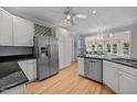 Bright kitchen features stainless steel appliances, sleek countertops, and ample cabinet space at 200 Frenchmans Bluff Dr, Cary, NC 27513