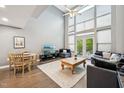 Bright living area with high ceilings, hardwood floors, and floor-to-ceiling windows at 200 S Dawson St # 114, Raleigh, NC 27601