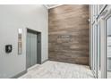 Well-maintained lobby with modern tile and elevator access at 200 S Dawson St # 114, Raleigh, NC 27601