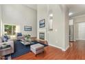 Bright living room with vaulted ceiling, fireplace, wood floors and plenty of natural light at 2409 Valley Haven Dr, Raleigh, NC 27603