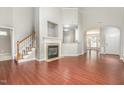 Spacious living room boasts a cozy fireplace and hardwood floors at 2409 Valley Haven Dr, Raleigh, NC 27603